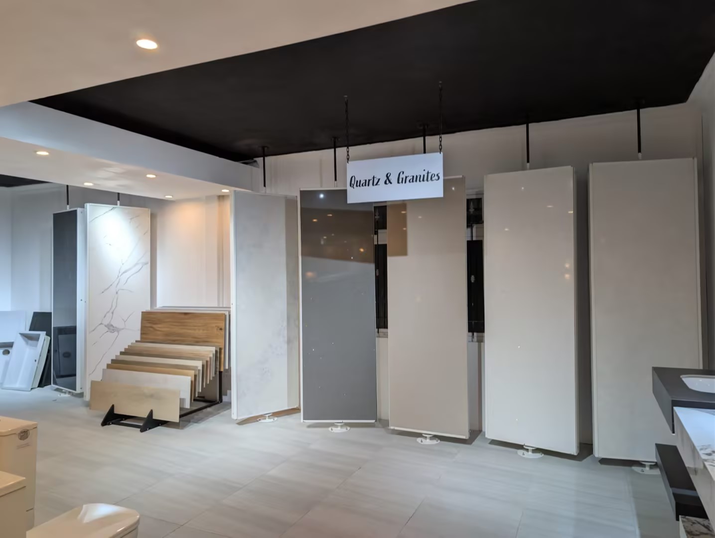 Showroom interior showing tile, stone and wood collections on display racks